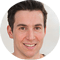 Man in white shirt smiling at camera
