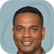 Man in gray shirt smiling