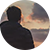 Man standing in front of cloudy sky