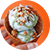 Hand holding waffle cone with ice cream